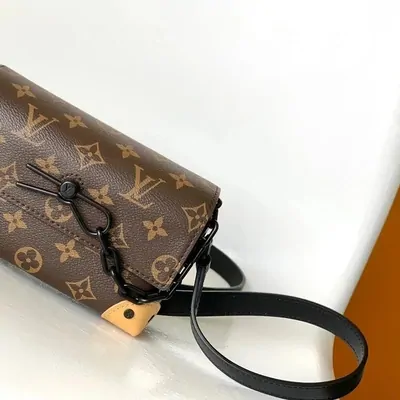 Small brown monogram crossbody bag with black strap