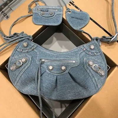 Washed denim shoulder bag with stud details