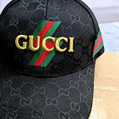 Black monogram cap with a striped band