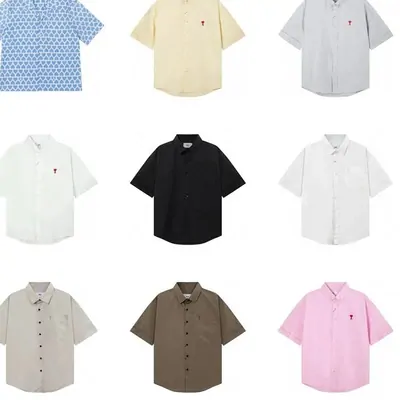 Short-sleeve polo shirts in cream, black and brown on a table