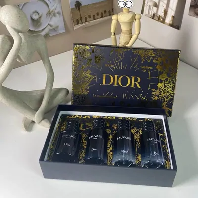 Dark gift box containing several small perfume bottles