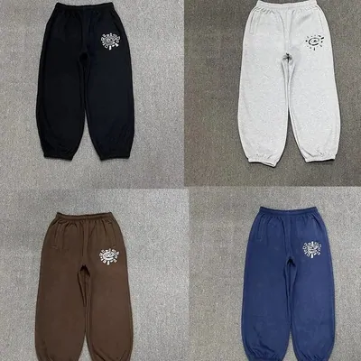 Four joggers in black, grey, brown and blue with small chest prints