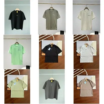 Plain heavyweight tees folded and hung in neutral tones