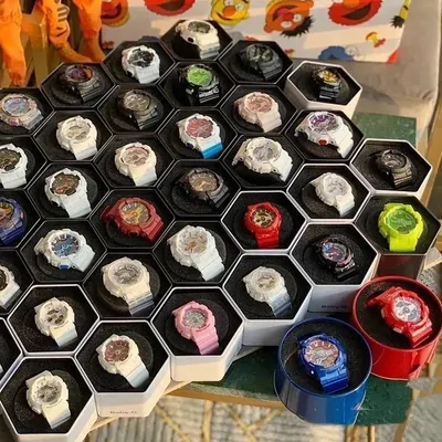 Honeycomb tray holding colourful watch heads
